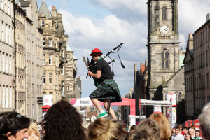 Kilted festival-goer on the Royal Mile at the Edinburgh Fringe Festival.